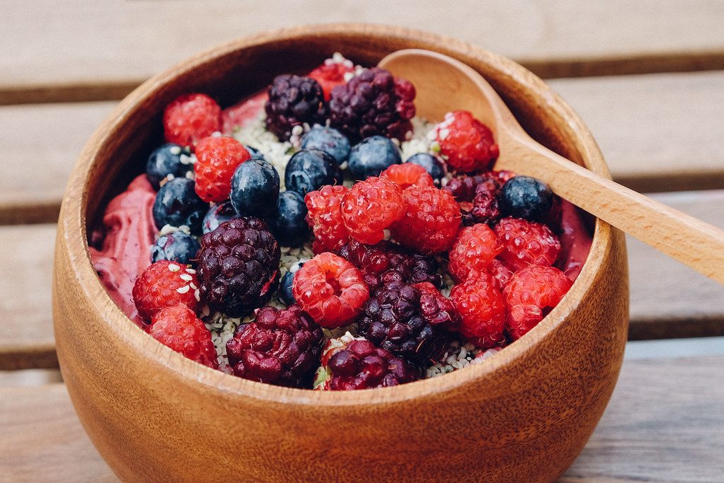 Acai bowl topped with fresh berries and coconut, a healthy Aruba breakfast