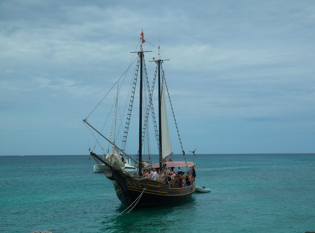A snorkel-cruise schooner anchored over the reefs off Aruba's northwest coast near the Antilla wreck