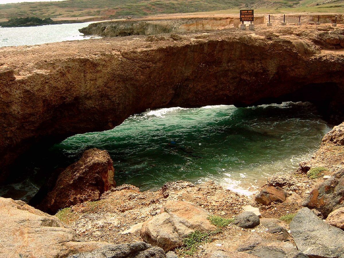 Aruba's rugged coral-rock windward coastline near the Natural Bridge