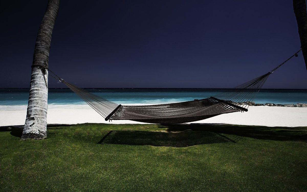 Hammock on Druif Beach Aruba, where the most affordable cheap all inclusive aruba resorts sit