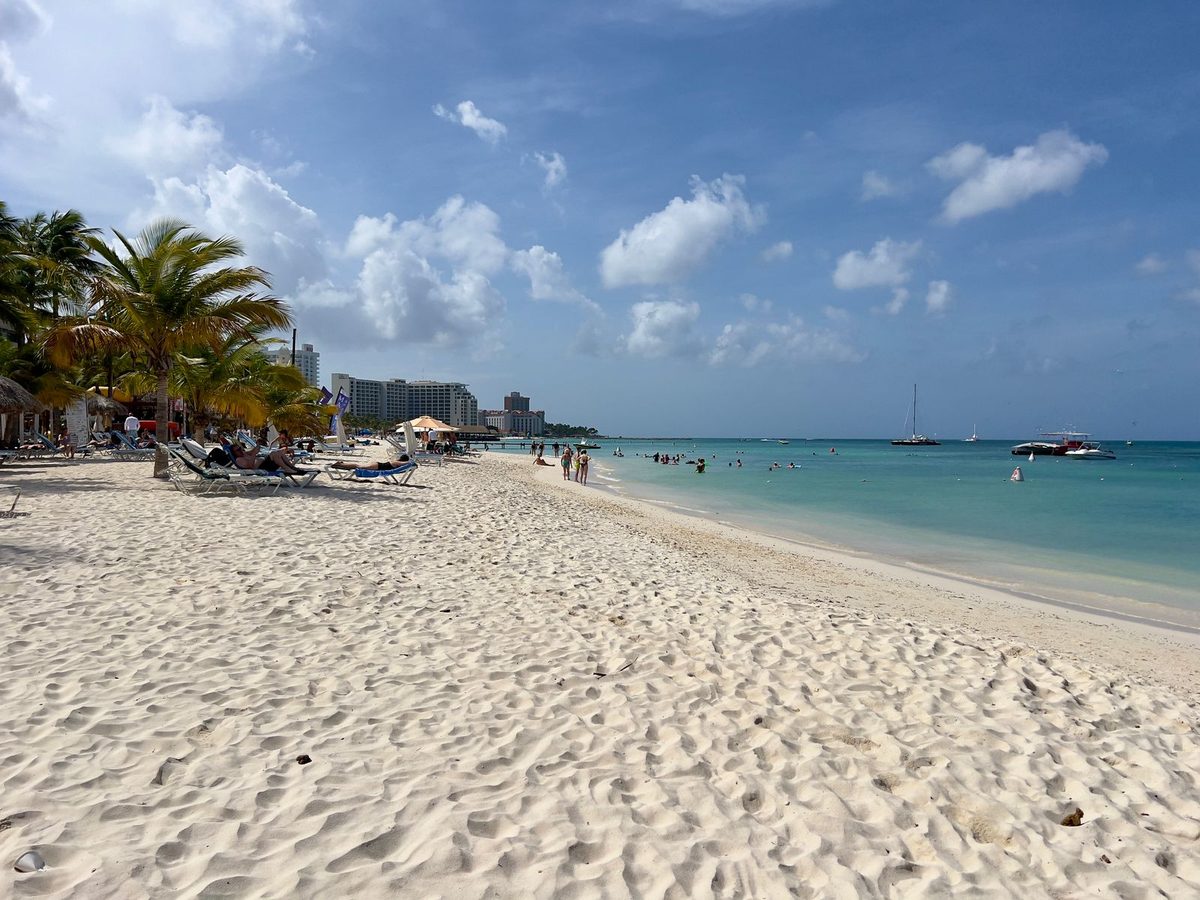 This Aruba family itinerary centers on calm, white-sand Palm Beach with turquoise water perfect for kids