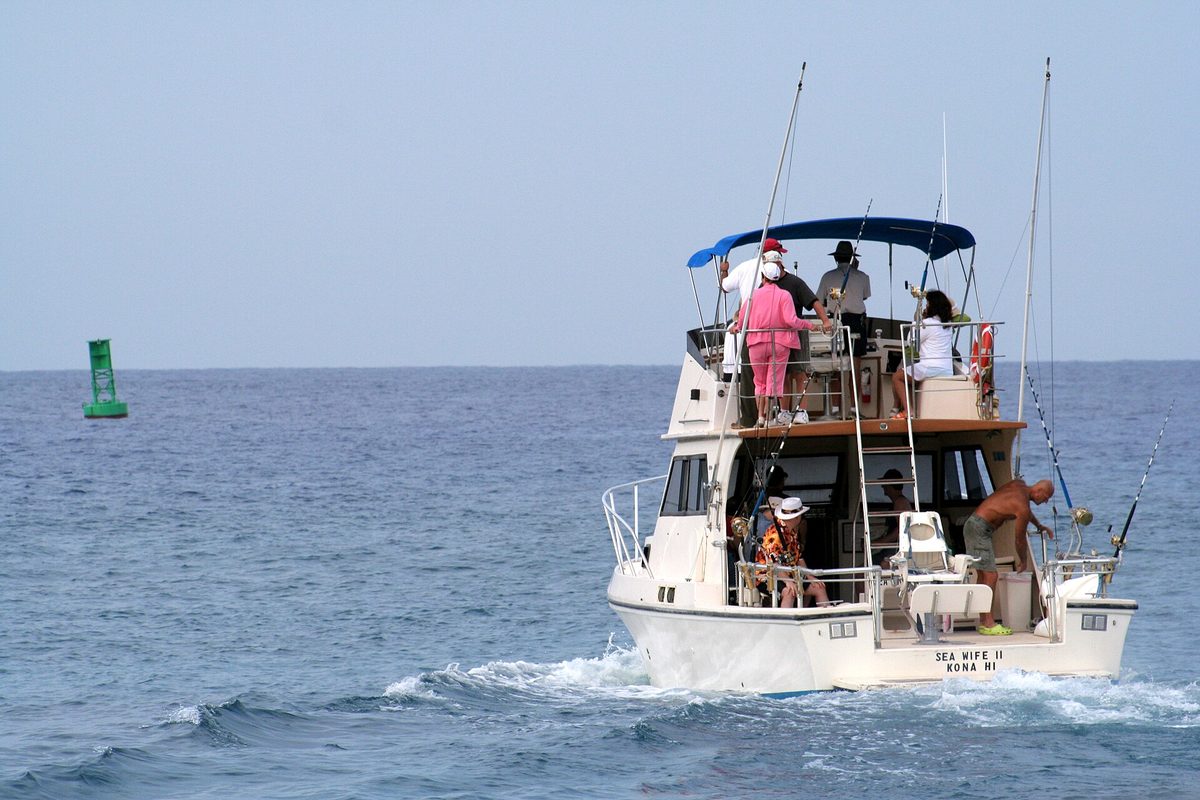 Aruba fishing charters head offshore on a sport-fishing boat into deep blue Caribbean water