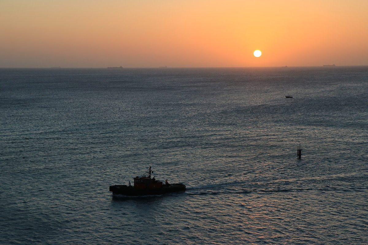 Golden sunset over the Caribbean Sea, seen from a sailing catamaran in Aruba