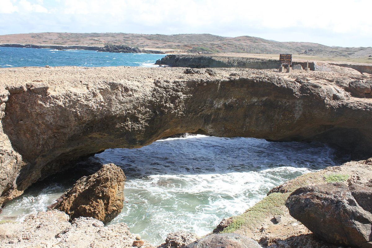 The intact Baby Bridge, a small limestone arch beside the collapsed Aruba Natural Bridge