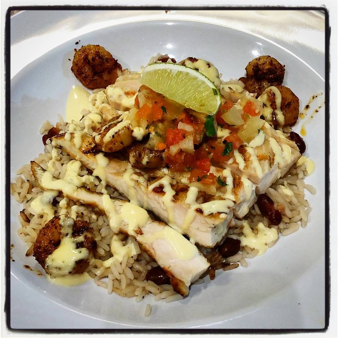 Grilled Caribbean chicken and shrimp over rice, an affordable island plate
