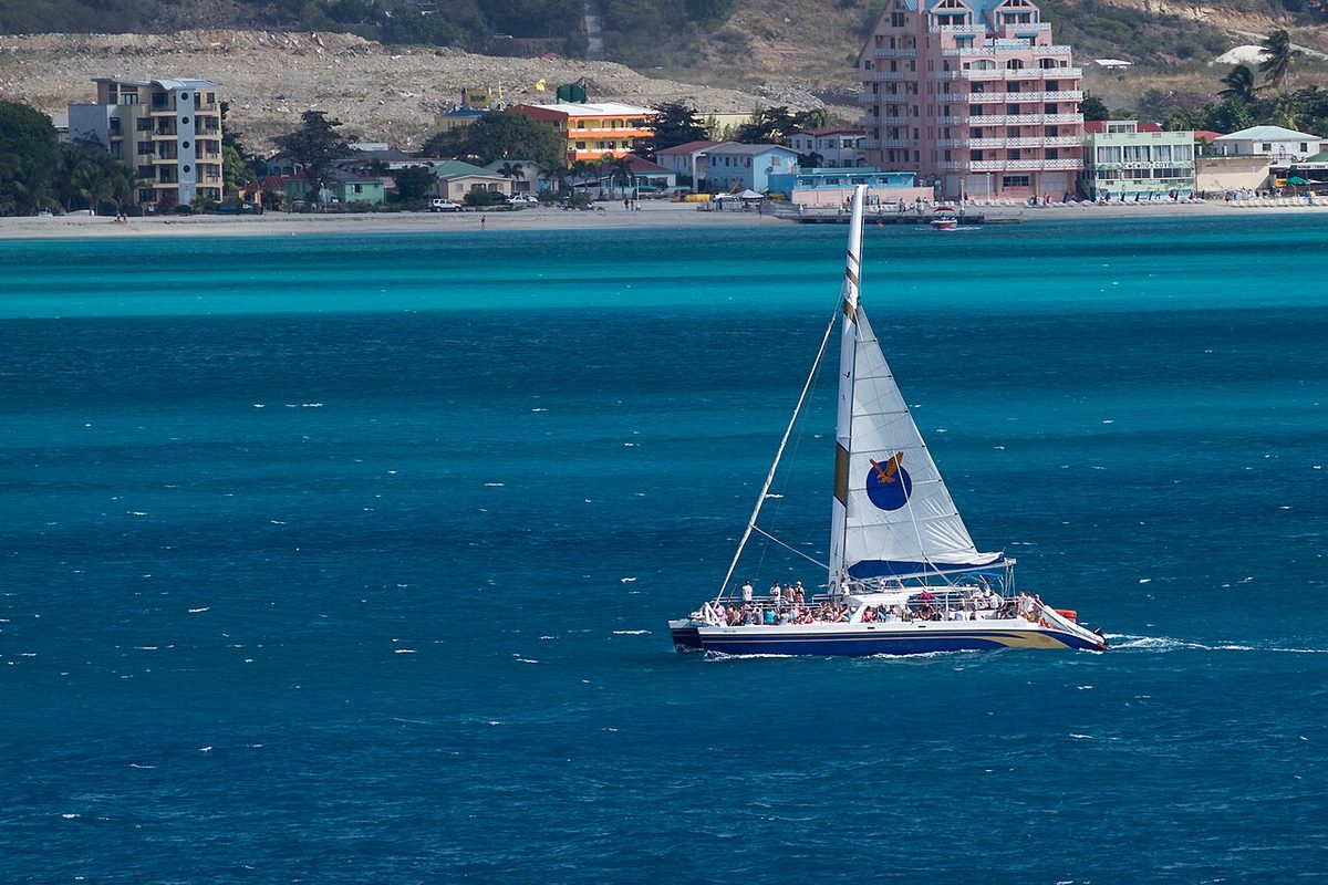 An aruba catamaran cruise sailing on turquoise Caribbean water off the coast