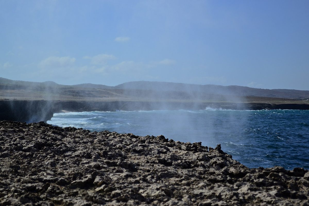 Rugged cactus-dotted coastline in Arikok National Park, Aruba