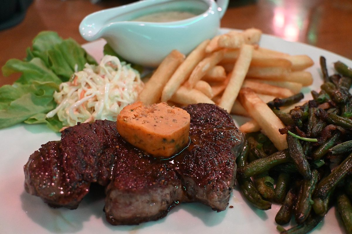A grilled steak dinner plated at an Oranjestad steakhouse in Aruba