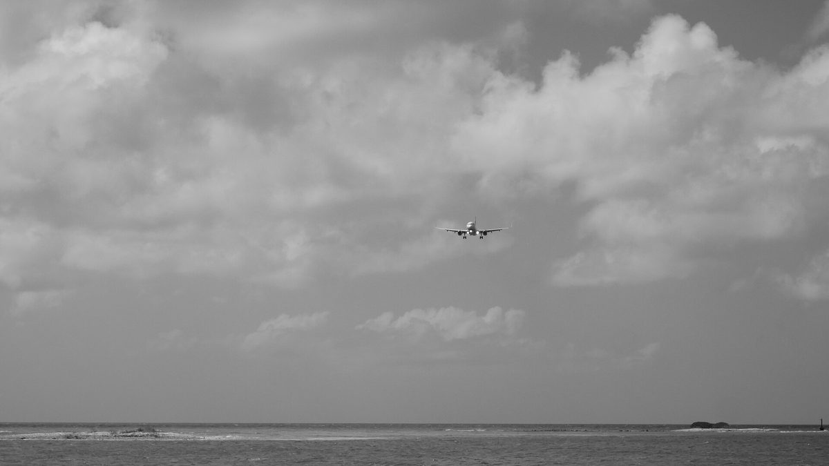 A jet on final approach for one of the daily flights to Aruba at Queen Beatrix International Airport