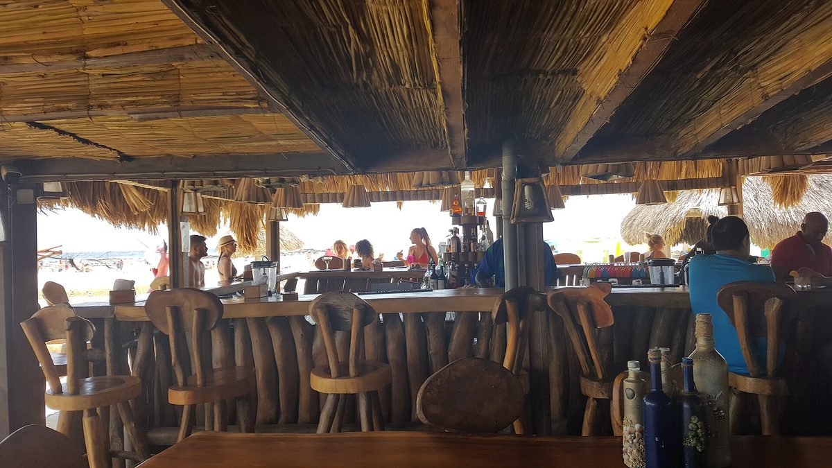 A beach bar in Aruba where a dollar or two per drink is a customary tip