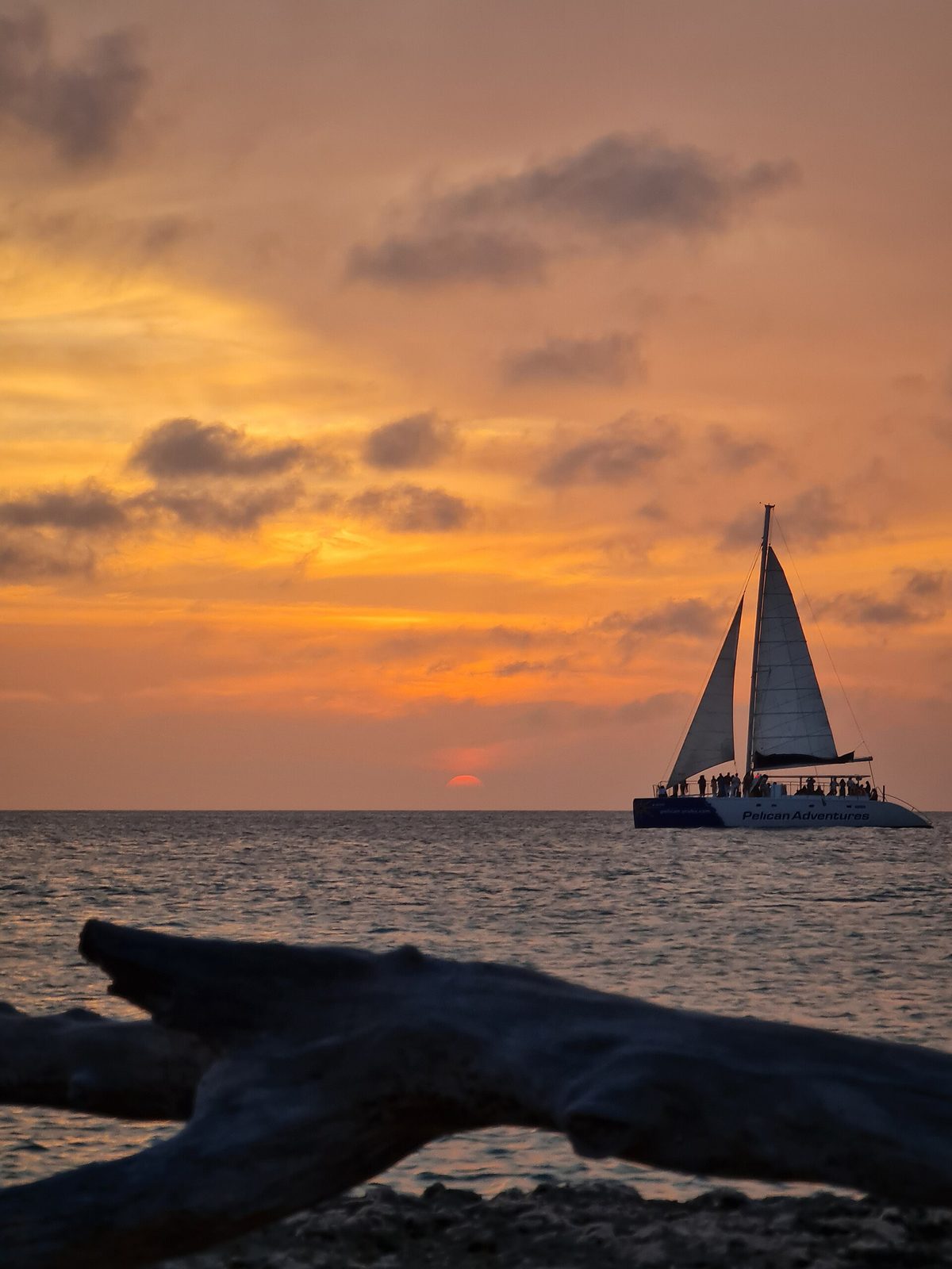 A catamaran sailing off Aruba, where the crew is typically tipped five to ten dollars per person